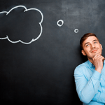 smiling-bearded-man-shouting-and-standing-over-blackboard-backgr